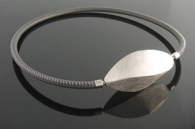Silver wave clasp on grey leather necklace.jpg