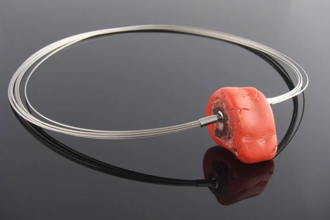 Steel wire multistrand necklace with removable red coral nugget feature clasp