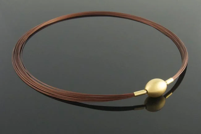 Brown wire multistrand necklace with gold ovoid feature clasp