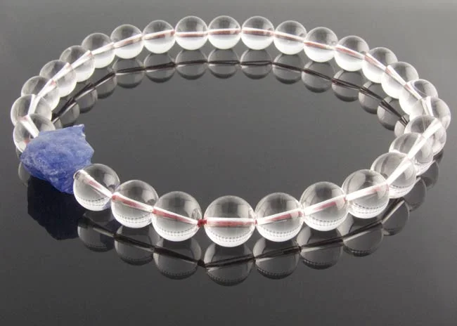 Clear quartz beaded necklace with rough tanzanite nugget clasp
