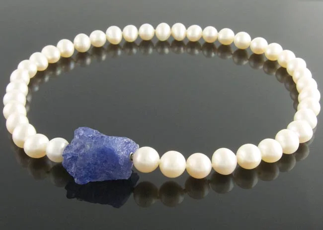 Cream freshwater pearl necklace with rough tanzanite nugget clasp