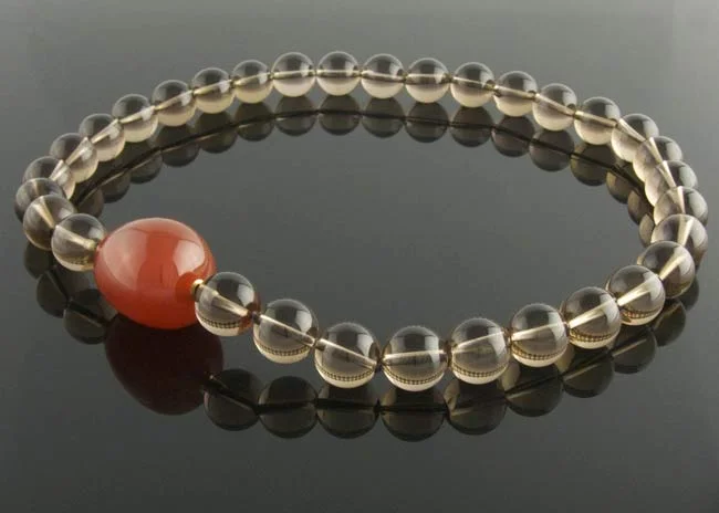 Smoky quartz necklace with interchangeable carnelian pebble clasp