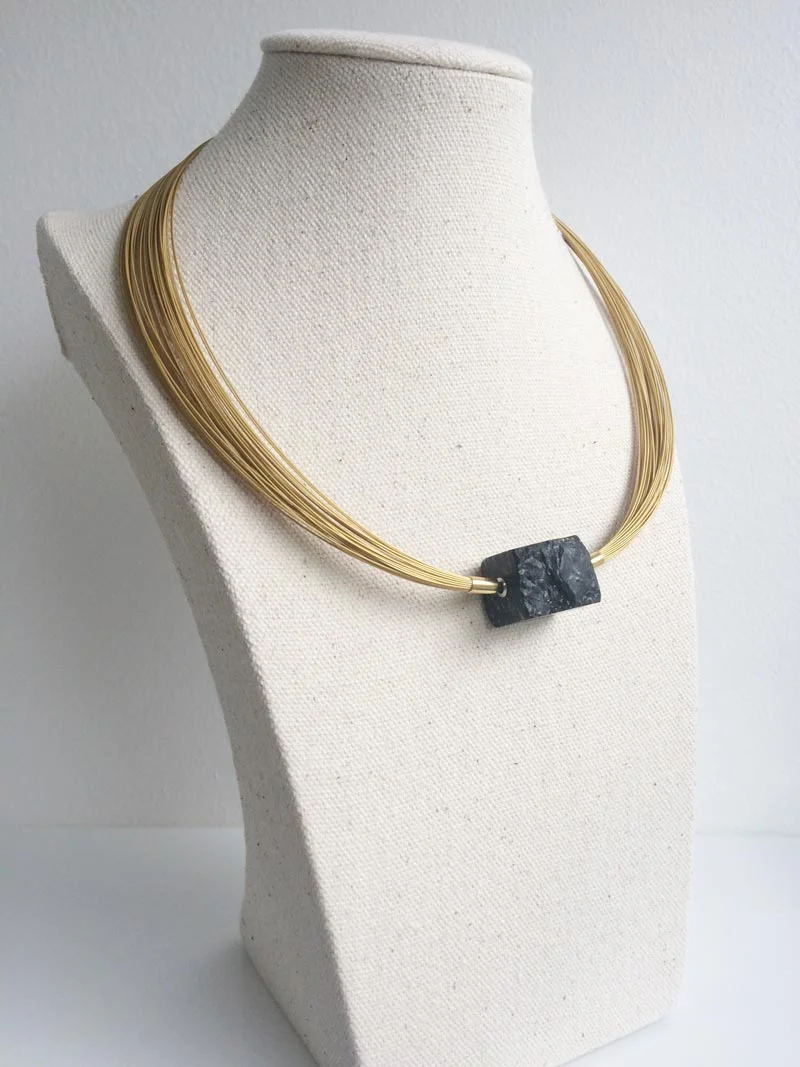 50-row-golden-multistrand-with-slate-pyrite-nugget-clasp.jpg