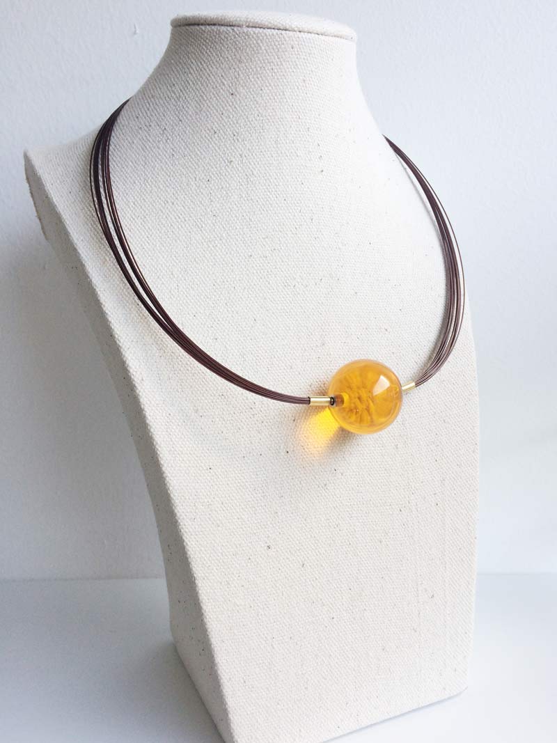 Brown wire multistrand necklace with yellow glass feature clasp