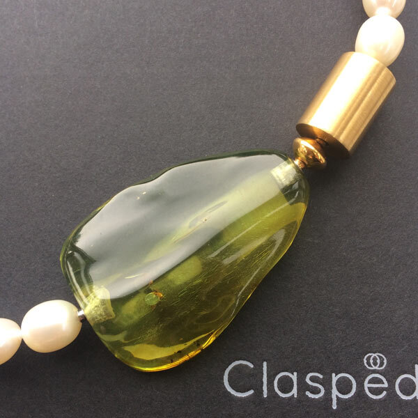 Cream pearl necklace with interchangeable green amber and gold cylinder clasps