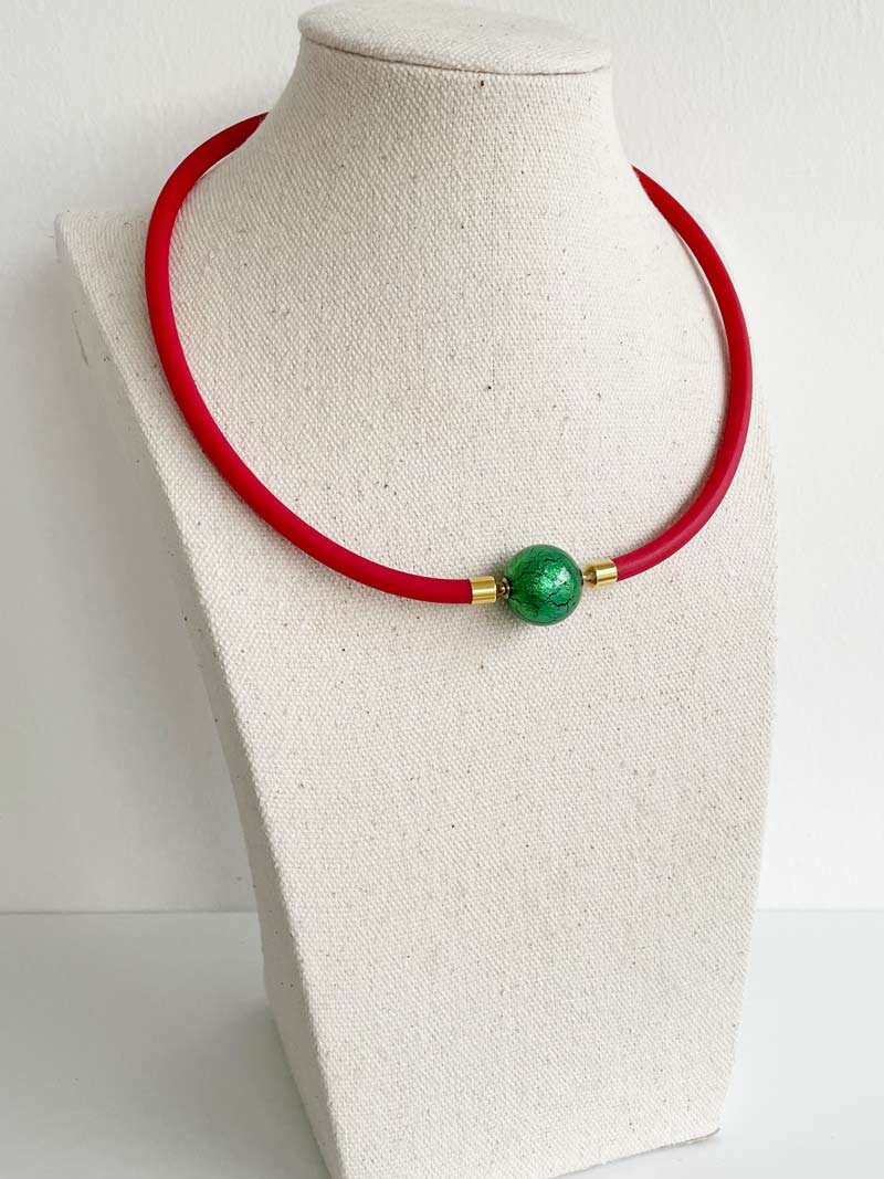 Red rubber with green Murano glass ball clasp