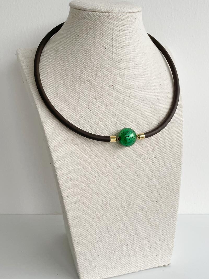 Brown rubber with green Murano glass clasp