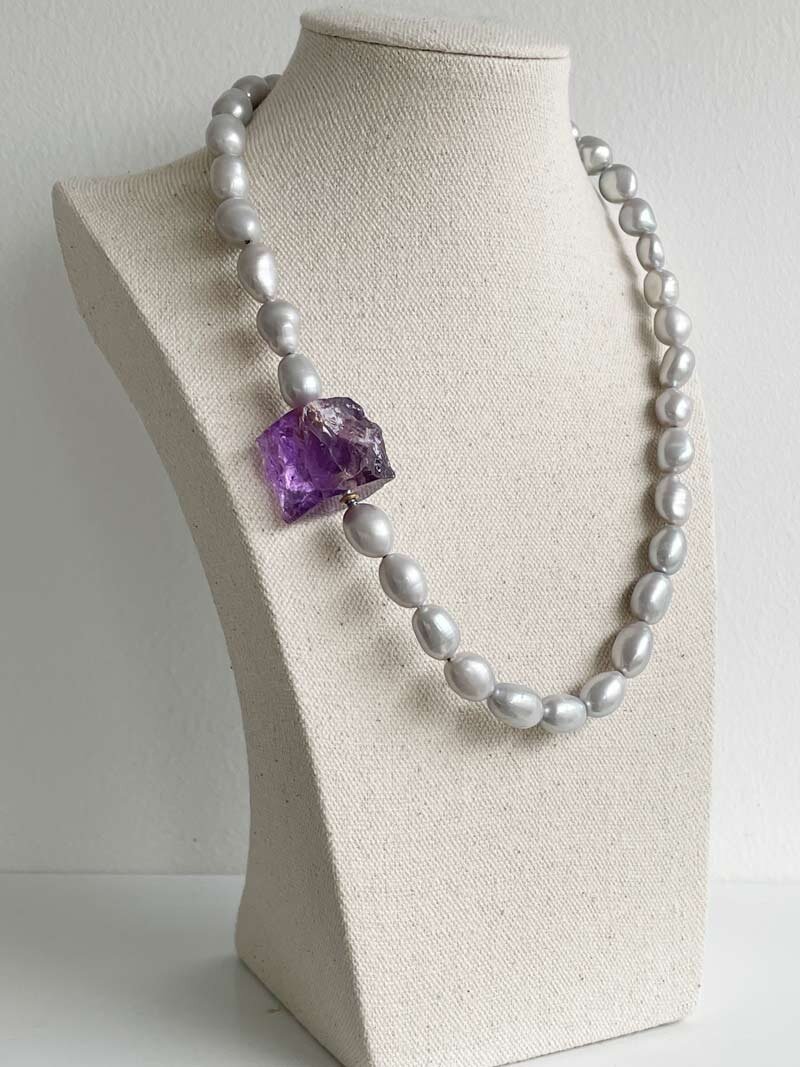 Baroque grey pearls with amethyst nugget clasp