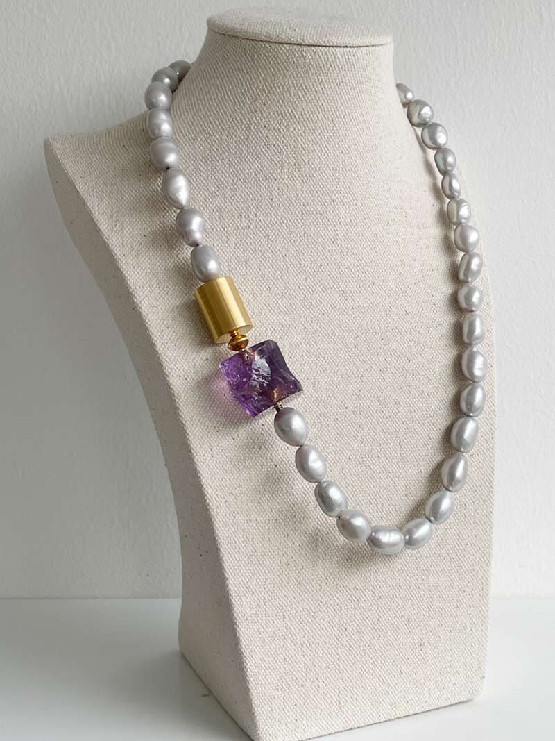 Baroque grey pearls with gold cylinder and amethyst nugget clasps in series