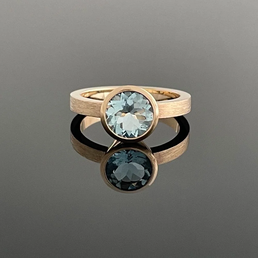 Picked up this beautiful aquamarine on my recent buying trip to Germany. It's hard to do justice to the colour in a pic, but it is a stunning shade of rich blue green. Set in my client's own gold.⁠
⁠
If you have a project you'd like to discuss drop m