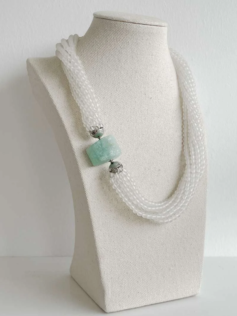 Matt rock crystal multistrand necklace with triangular aquamarine clasp