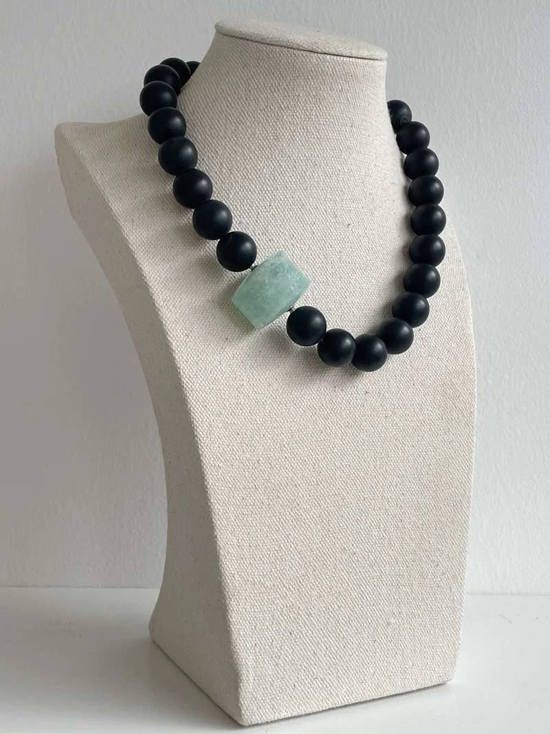 Matte black onyx bead strand with interchangeable aquamarine feature clasp