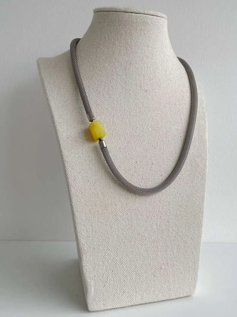 Steel mesh necklace with interchangeable yellow agate feature clasp
