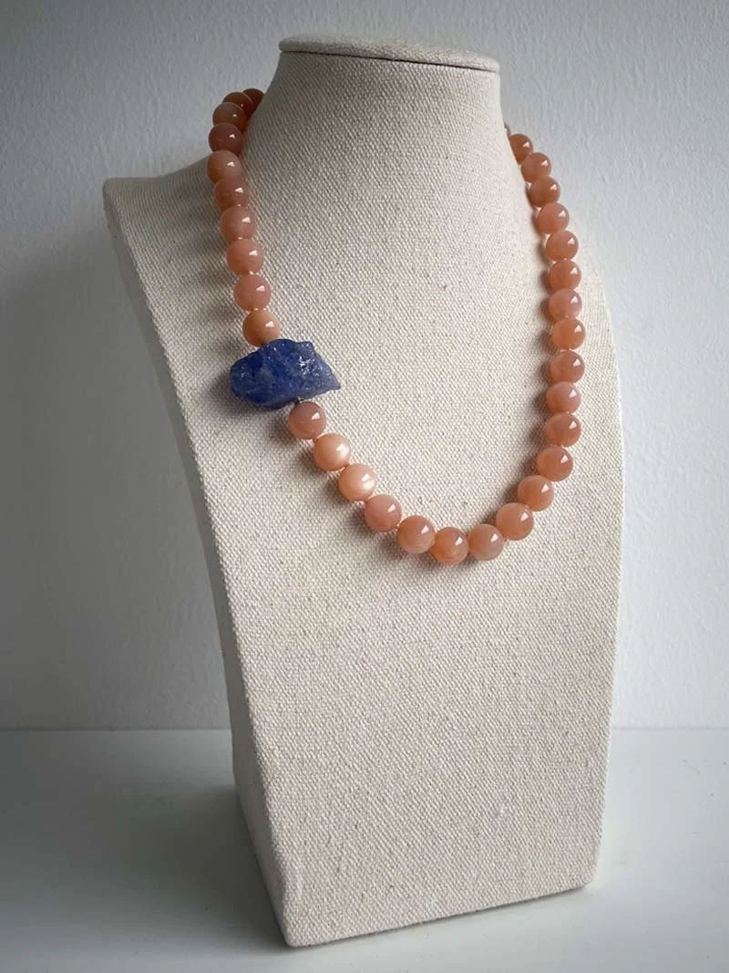 Orange moonstrand bead strand with interchangeable tanzanite feature clasp
