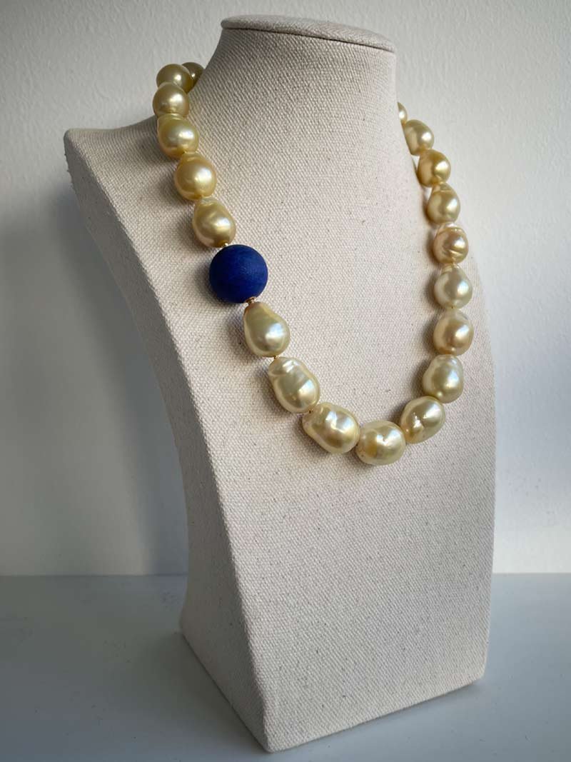 Golden South Sea baroque pearl necklace with interchangeable matte lapis feature clasp - part of Clasped's interchangeable necklace system