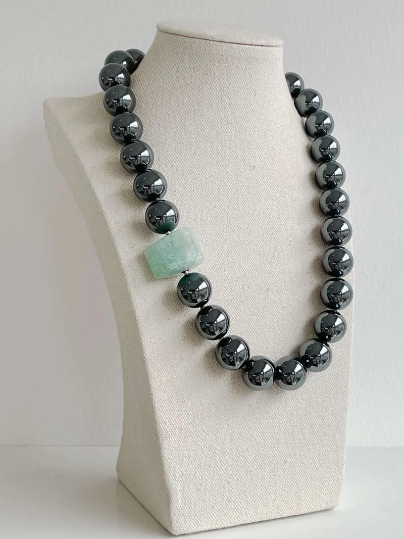 16mm hematite bead necklace with interchangeable triangular aquamarine feature clasp