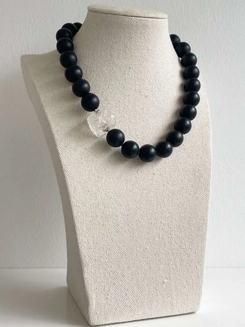 Rock-crystal-cube-on-14mm-matte-black-onyx-.jpg