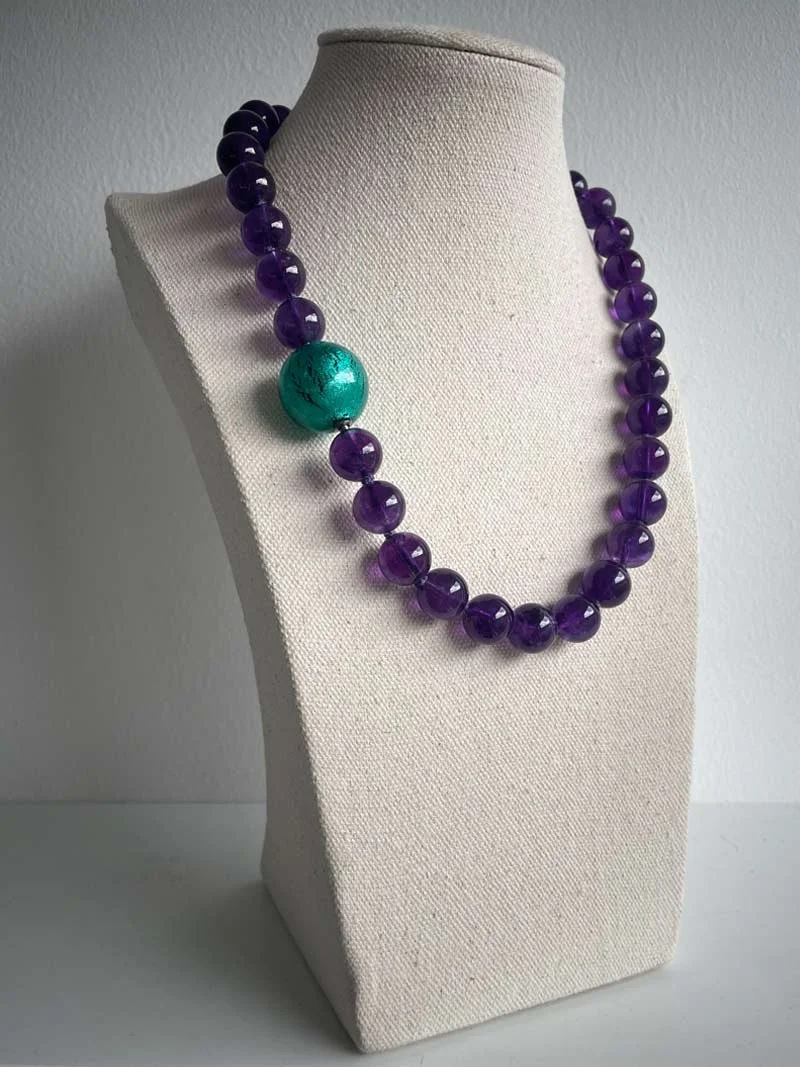 Amethyst bead strand with interchangeable blue green Murano glass feature clasp - part of Clasped's interchangeable necklace system
