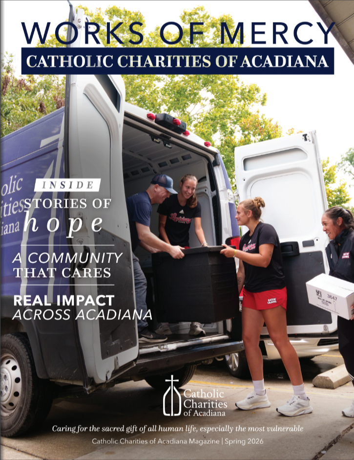 People loading a truck with items for charity