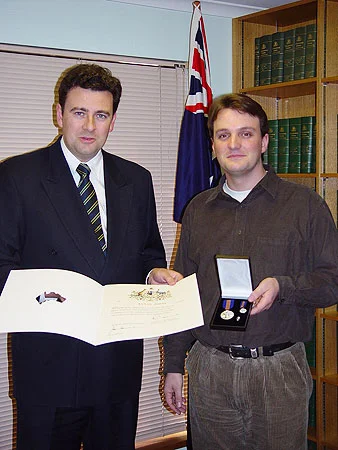 Receiving the Centenary Medal from Andrew Southcott MP for my services to music.
