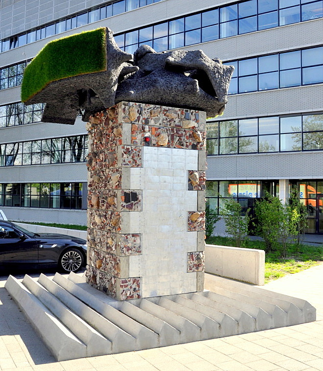 Untitled (Roteb Eco Monument) 2010-2011, Staircase, rubble, mortar, aluminium production waste, 90 bicycle wrecks, 11 m3 used wrapping foil, Aquadyne (recycled plastics), solar panels, fertilizer system, grass. 455x402x402 cm. Special thanks to: Prof.Dr. W. Sinke, Dr. N. Reich, Utrecht University, Erik Eikelboom Msc., Dir. R&D Centrosolar group AG, Prof.Dr.Ir. P.C. Struik, Wageningen University & Frans van der Sanden, Rogroen, Rotterdam. Photo: J.E. Visser. 