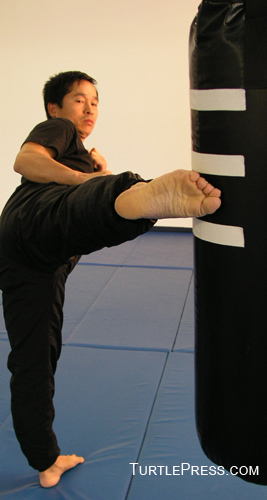 Mark the bag with tape to create kicking target zones