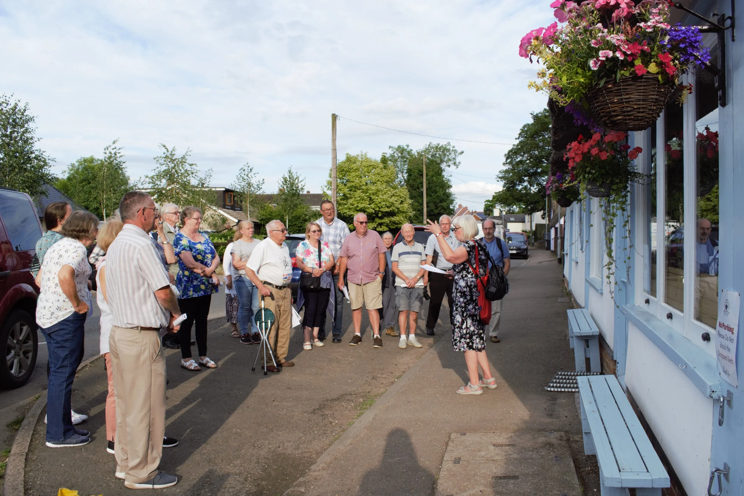 Margaret with visitors outside the Old Butcher’s Shop now a popular Coffee Shop