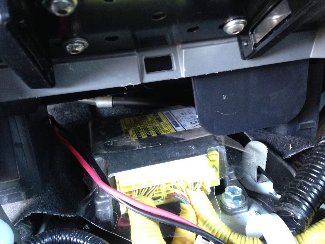 Note the grey mystery tab on the right. Relieving a notch out of the left side allowed clearance for the antenna lead.