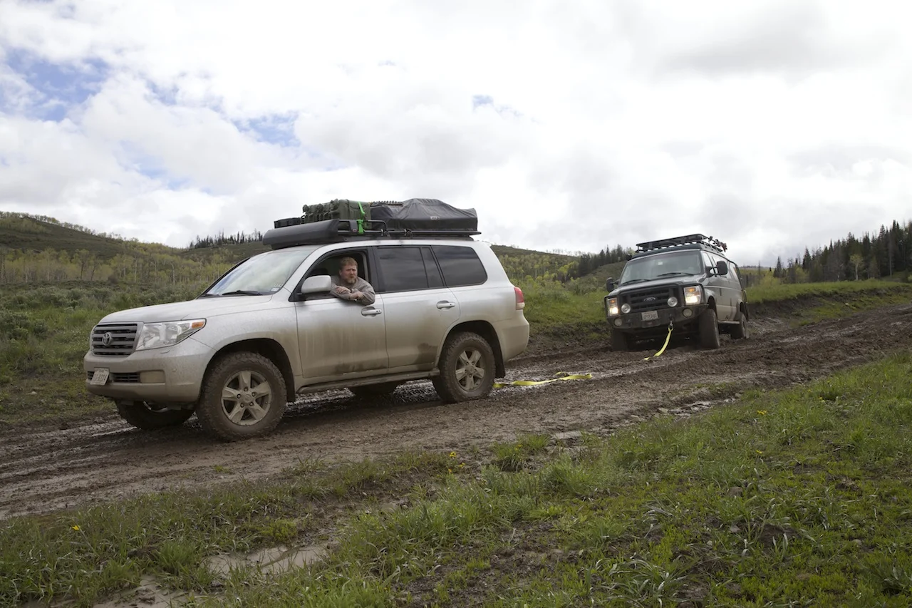 David Alley prepares to gently tug the Sportsmobile out of a ditch.