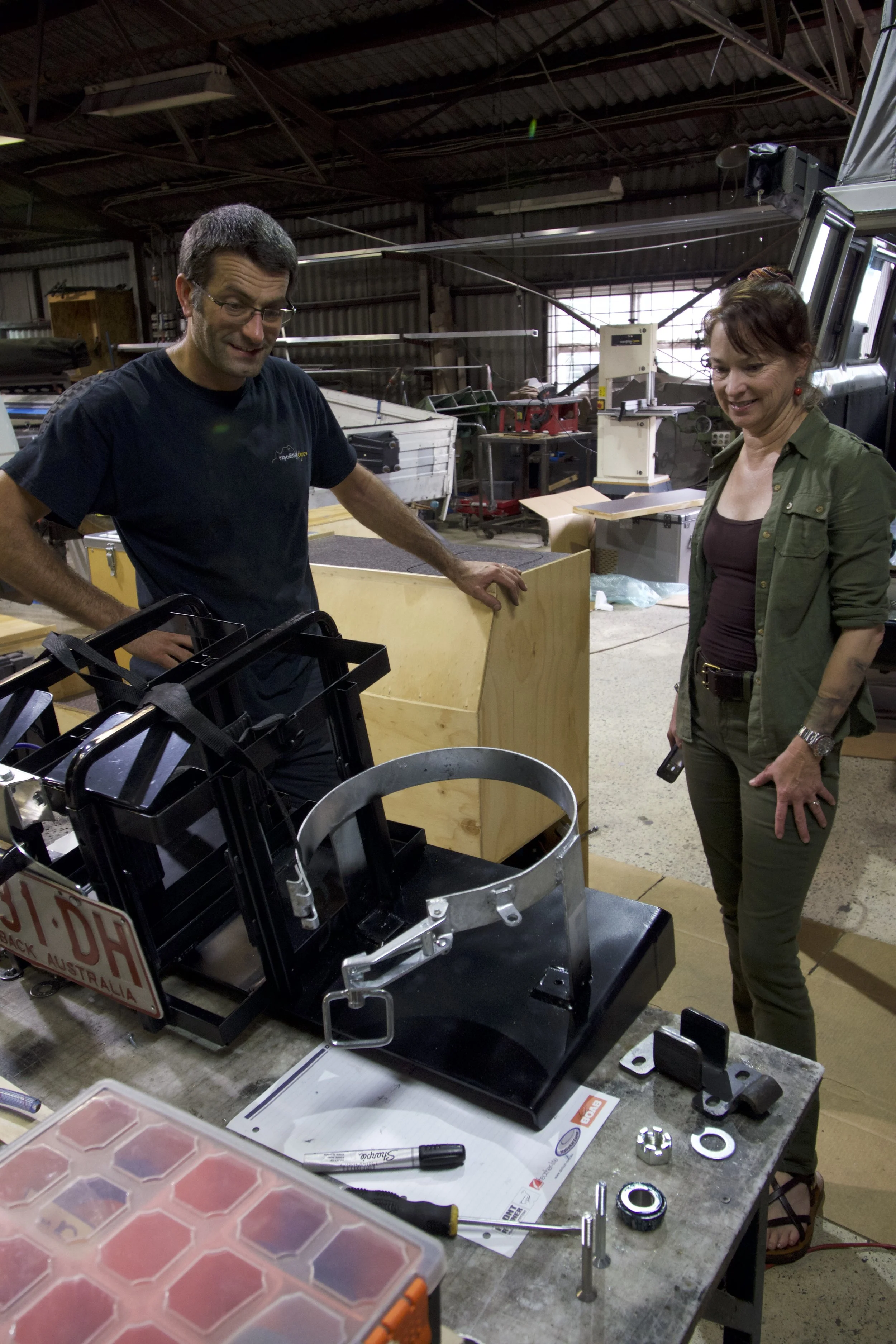 Daniel and Roseann inspect the jerry can/gas bottle holder for the Kaymar.