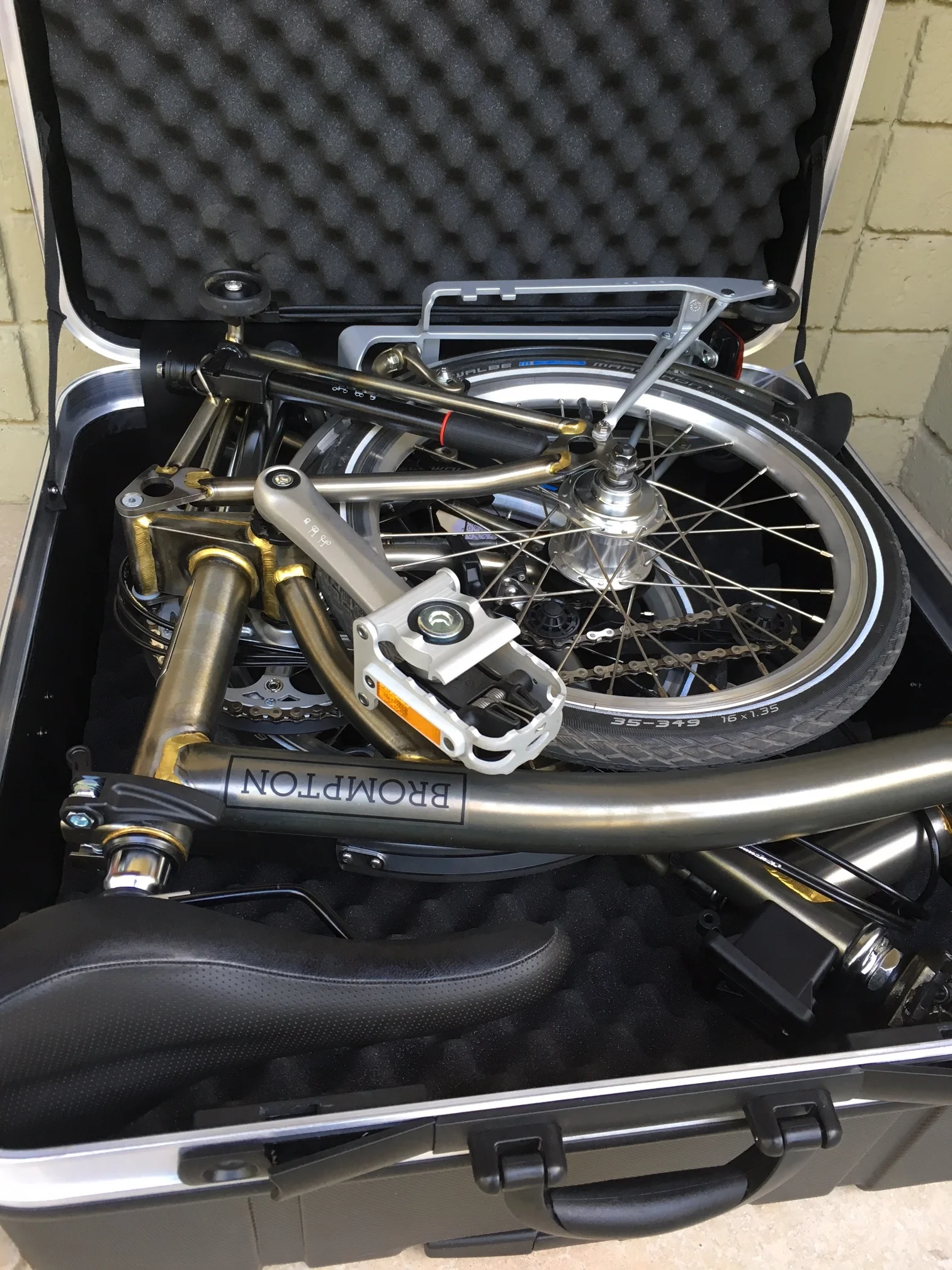 Among many aftermarket options is this excellent, wheeled hard case.