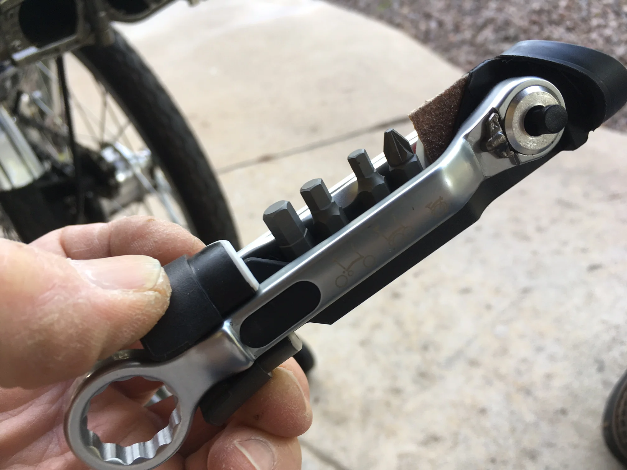 A clever, rattle-free (optional) tool kit held in with a magnet. It includes tire levers and patches. 