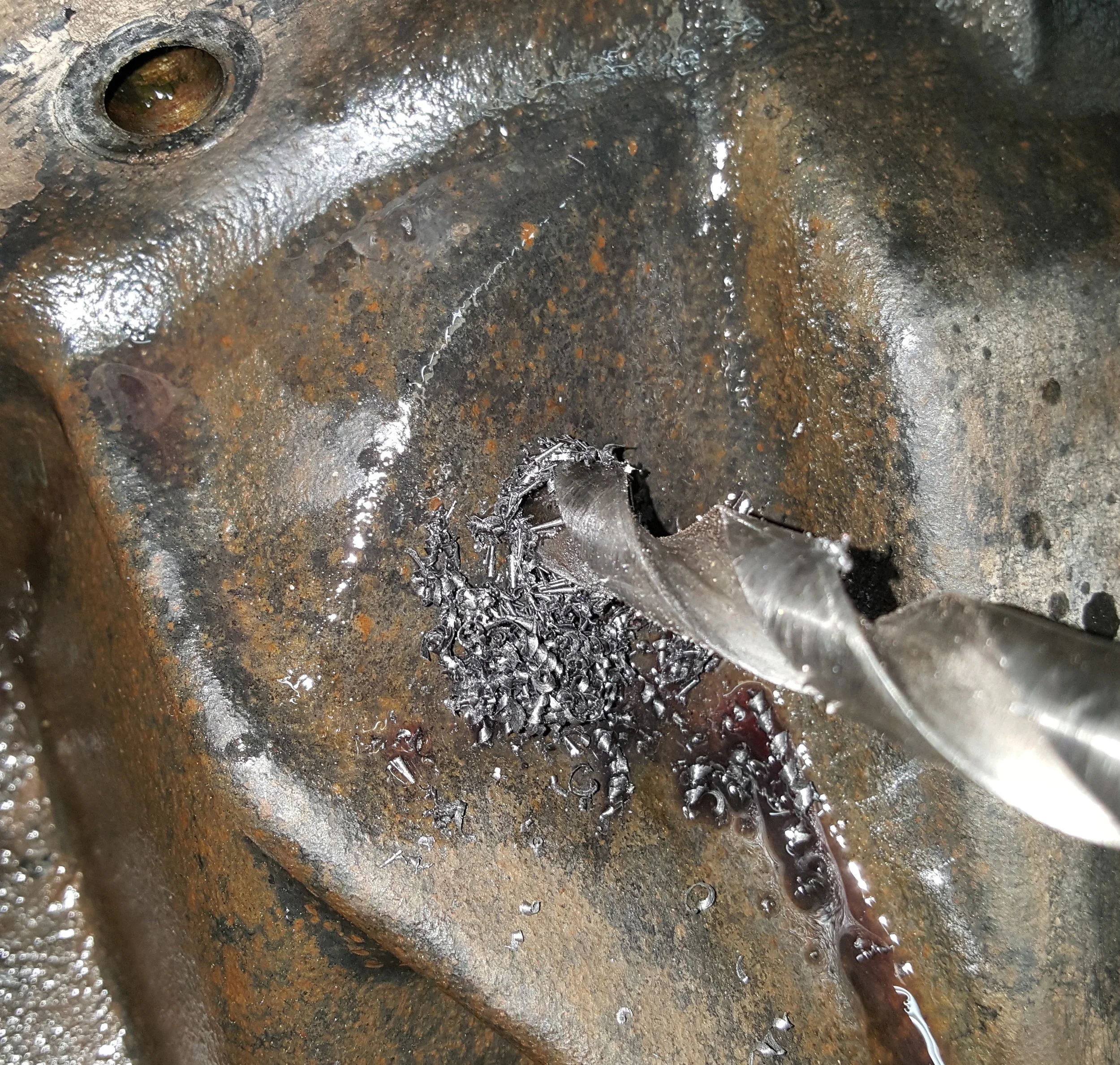 The fun part: drilling a hole in a perfectly good differential housing.