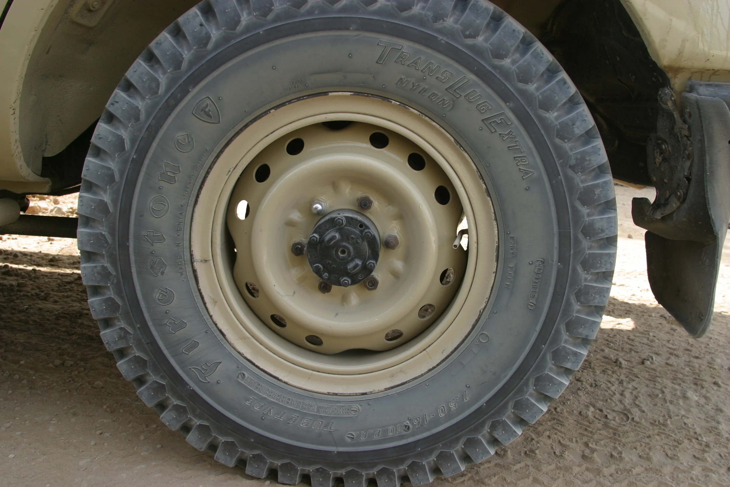 African Firestone tire on a split rim.
