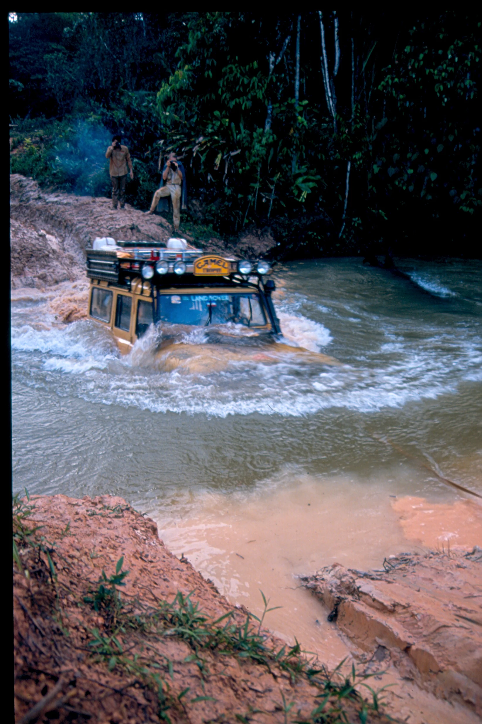 With non-electronically controlled turbodiesel engines and well-sealed snorkels, vehicles such as this Camel Trophy Land Rover 110 are capable of fording very deep water indeed. Courtesy Pete Sweetser/Camel Trophy Owners' Club