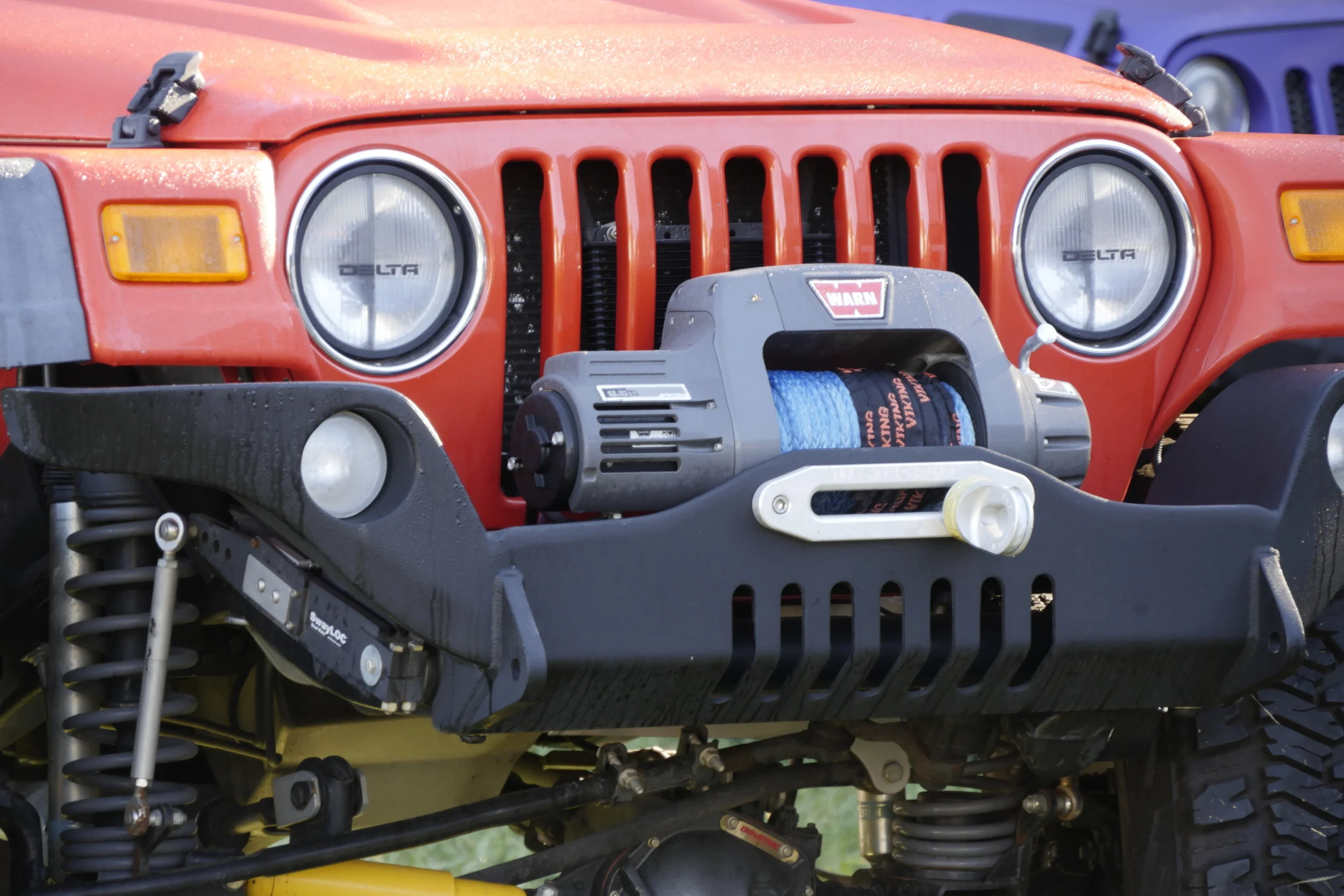 Many overlanders would scoff at this "rock-crawling" bumper on a Wrangler—but access to the winch is excellent. (However, as long as we're here, I don't like the shallow radius on that hawse fairlead.)