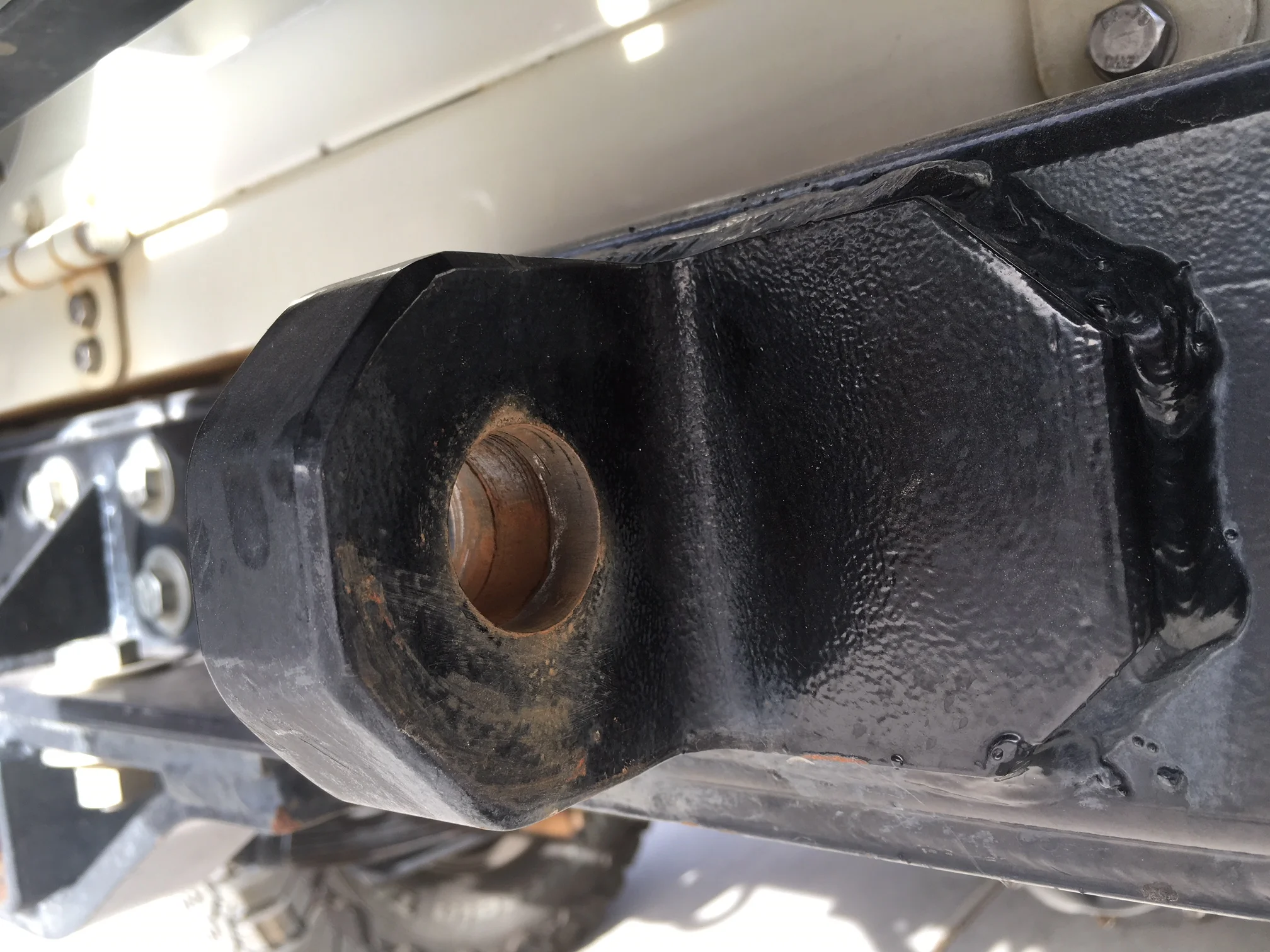 The FJ40's rear shackle mounts are very sharp-edged. No problem for a steel shackle if the pin fits properly.