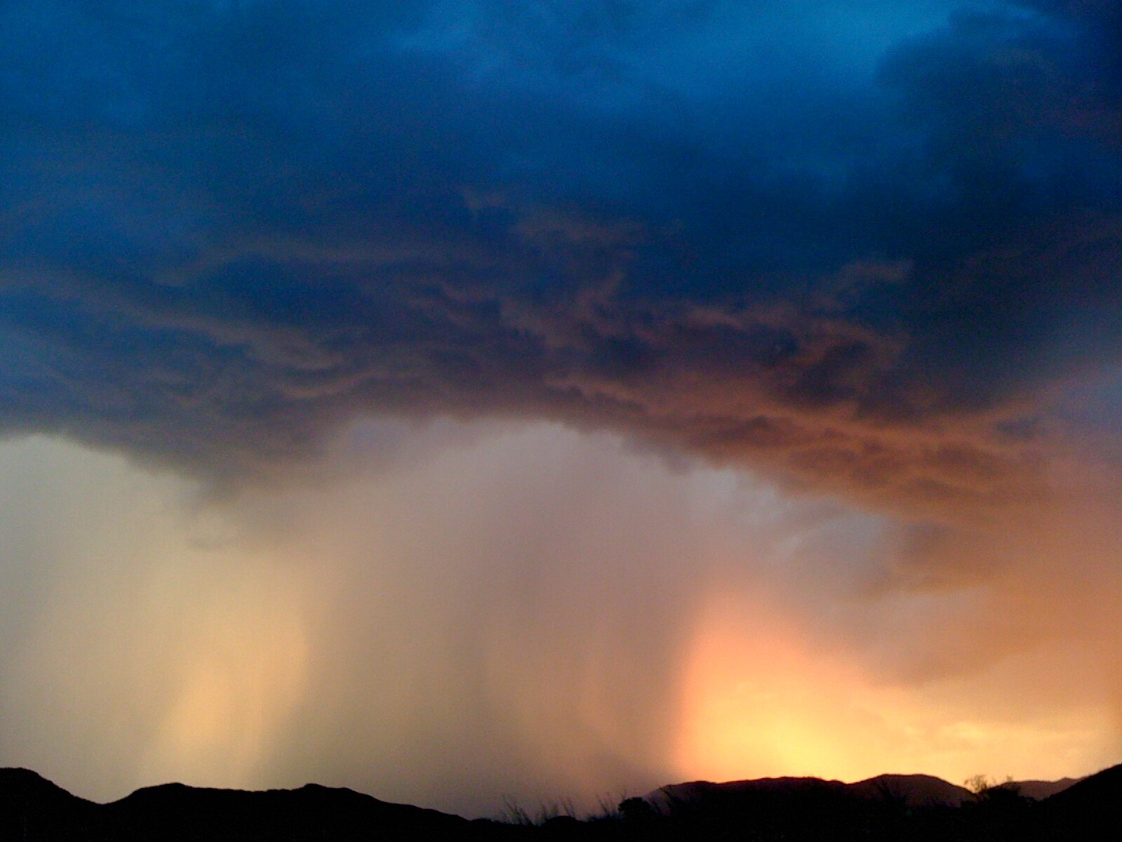 Stratocumulus cloudburst with outflow, Ravenrock, Southern Arizona, USA , by Roseann Hanson 
