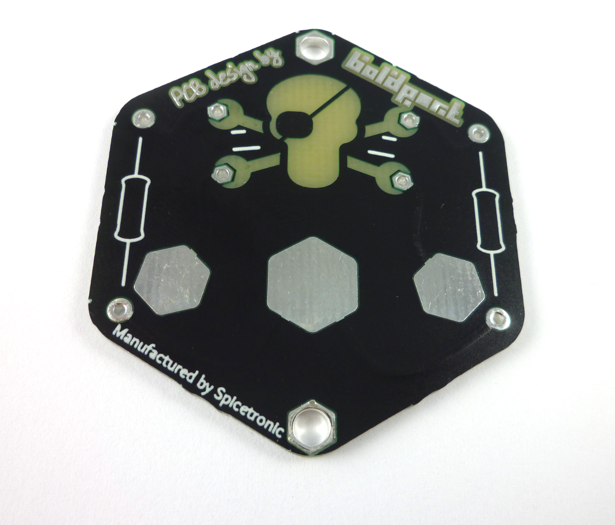 Back of the badge -- the three large pads are for a battery holder