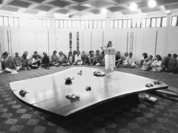 Mira Nakashima, playing the flute at the unveiling of the third Altar for Peace in Auroville, India.