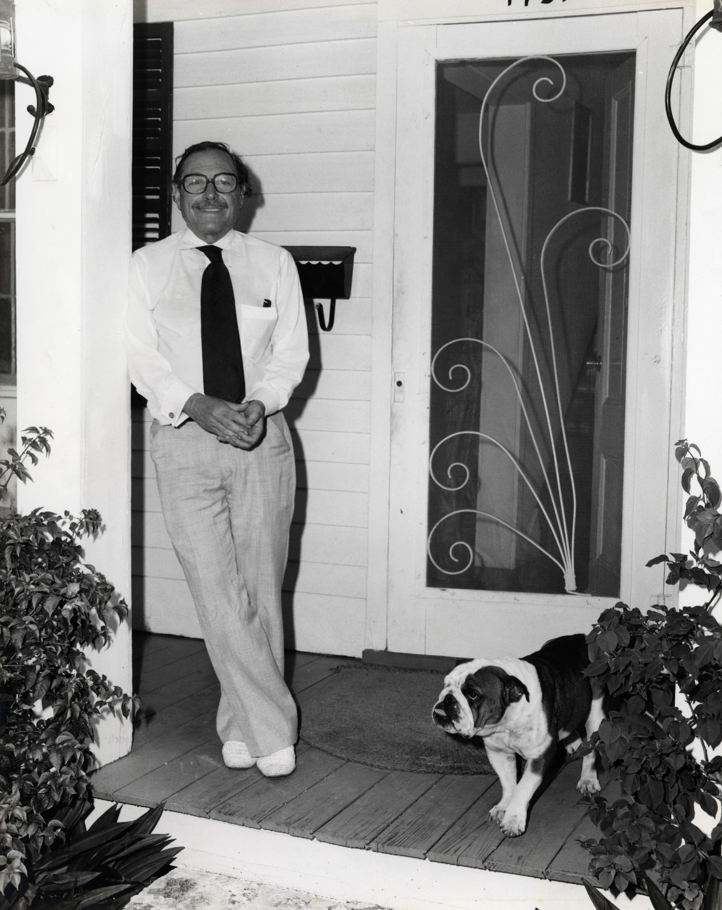 Tennessee Williams on his porch on Duncan Street. He bought the house in 1949 and owned it till his death in 1983. Photo from the Monroe County Library collection.