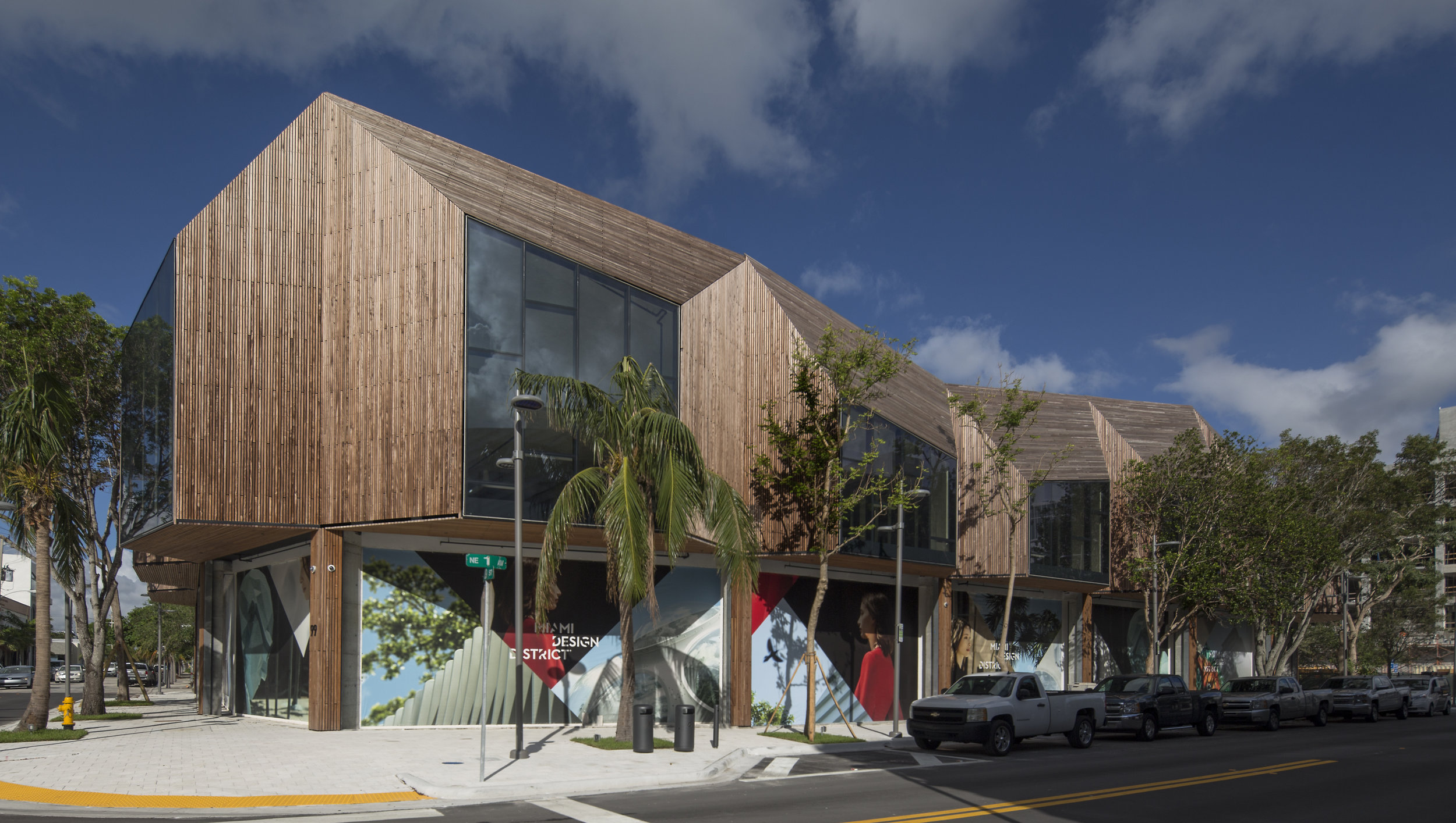 Sweet Bird South. A two-story retail building, the first concept design Norwegian & Fora landmark retail building at Miami Design District, with a total of 31,178 square feet. located at 99 N.E. 39th Street, Miami FL The building highlights high mansards pitched roofs and vertical surfaces with weathered IPE wood cladding from the Brazilian Amazon, and monumental windows with LED lighting frames, making it a spotlight in the upscale setting of the Miami Design District. The retail stores feature double high cathedral like ceilings. The project is considered a landmark at its early completion given the iconic design of the building. The rooftop Garden Roof design is inspired with swirls from radar’s subtropical weather “doppler”, arranged with over 18,000 multi-color plants. SF: 31,178 SF Completion Date: October 1, 2017