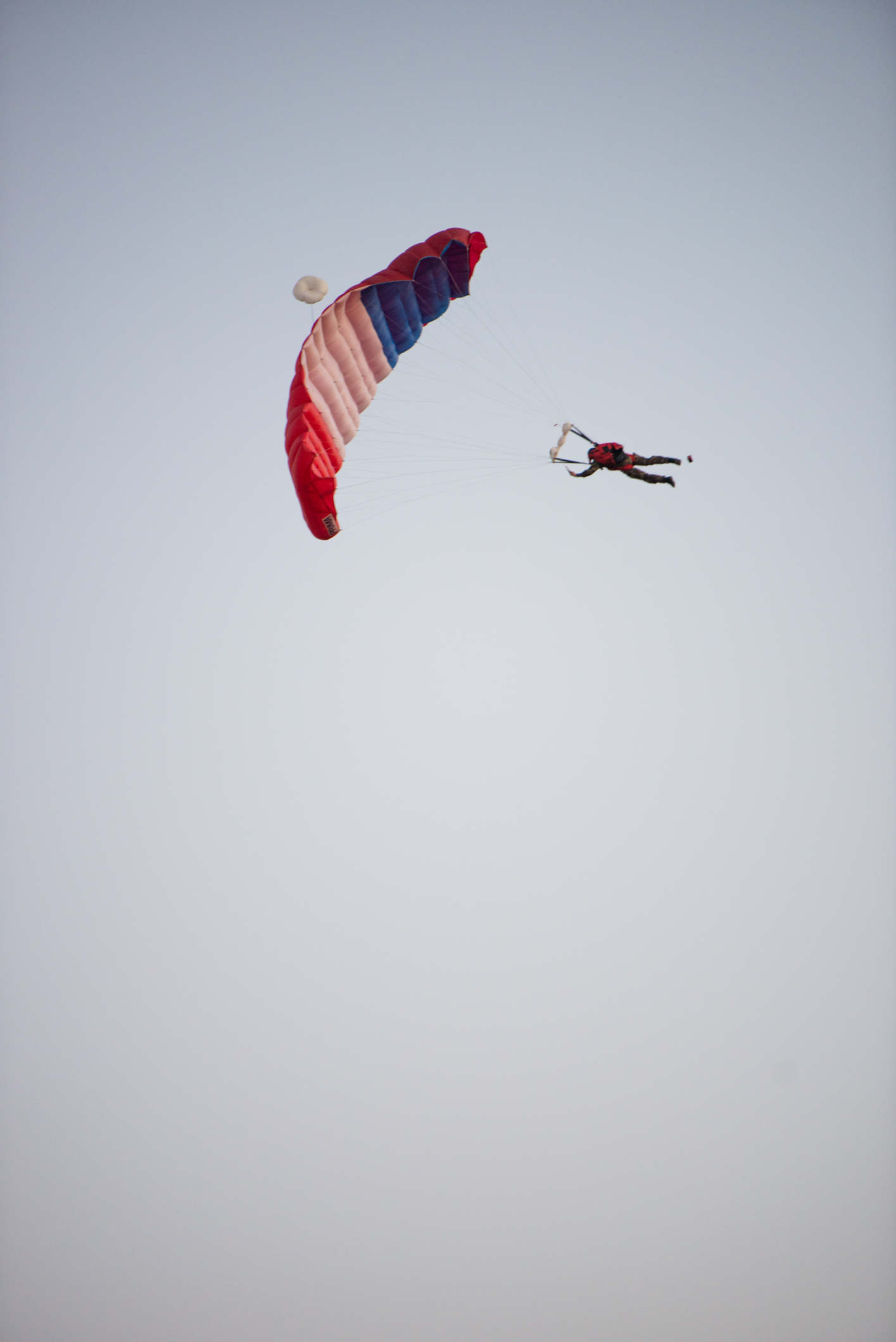 To celebrate Bastille Day, paratroopers jumped from planes and landed to the surprise of visitors.