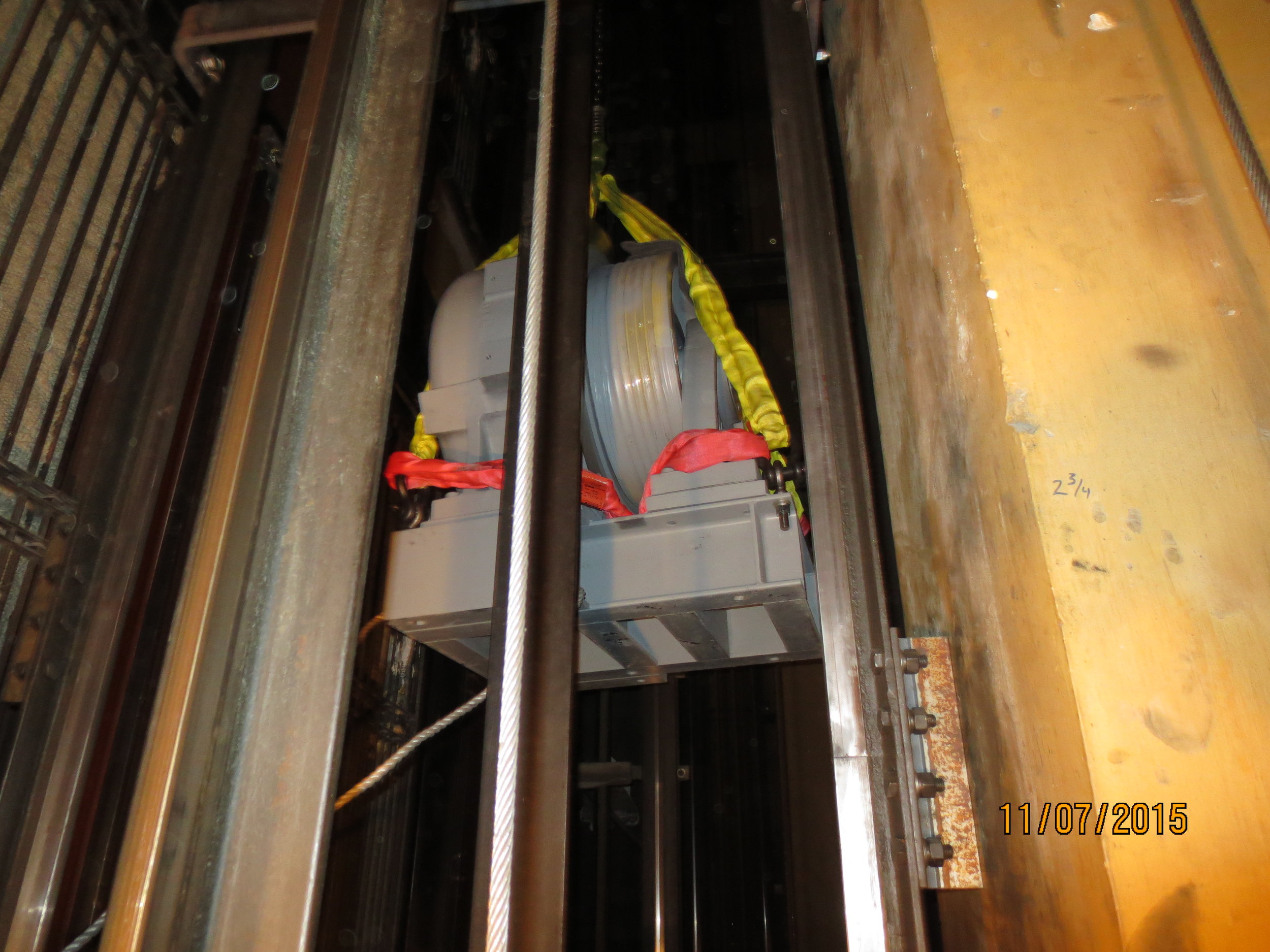 Hoisting new equipment up through elevator hoistways because of limited access.