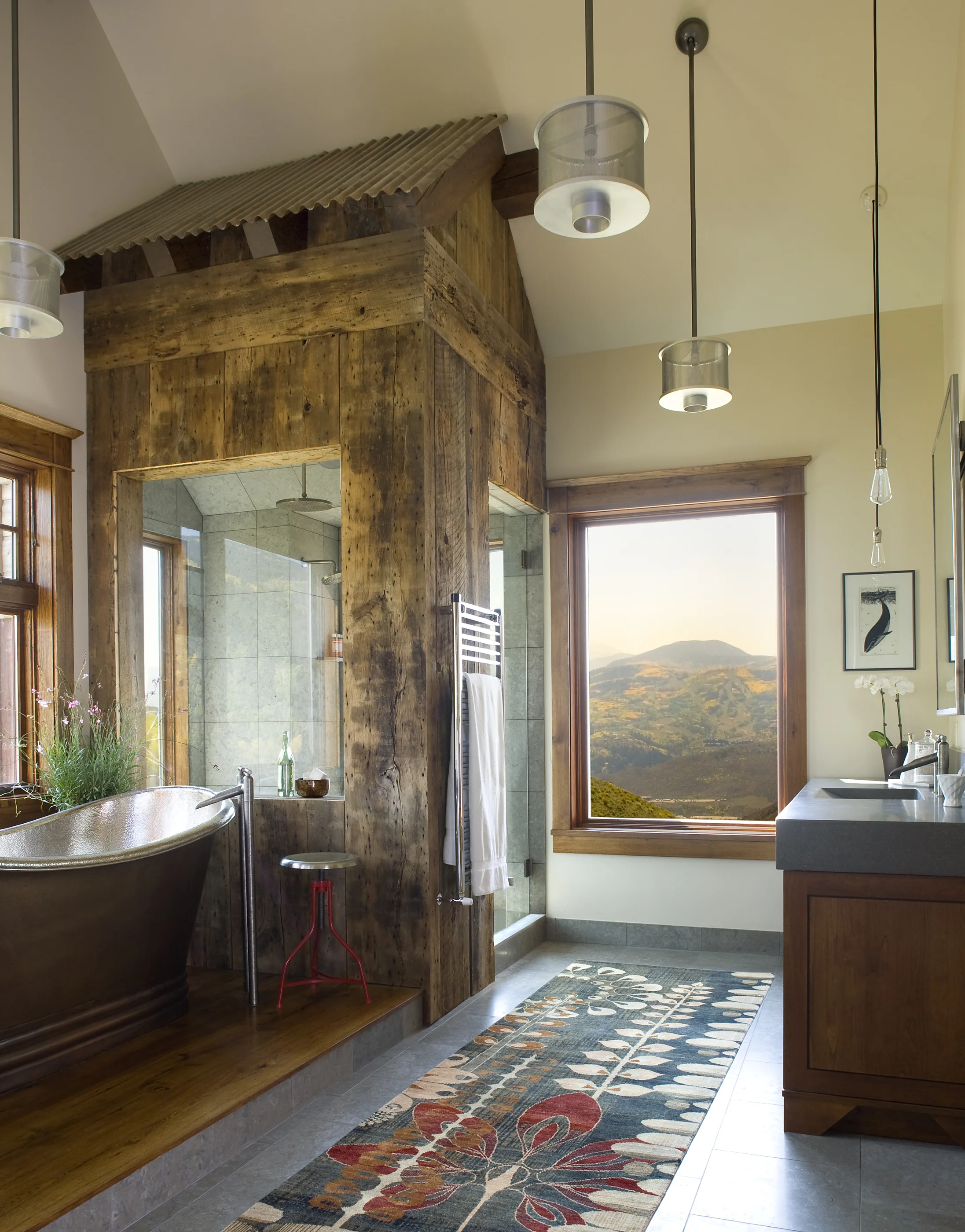 Master Bath with elevated tub with private valley views; steam-shower with Beaver Creek views. This Master Bathroom was featured in Best of Baths in Colorado Homes & Lifestyles, 2009.