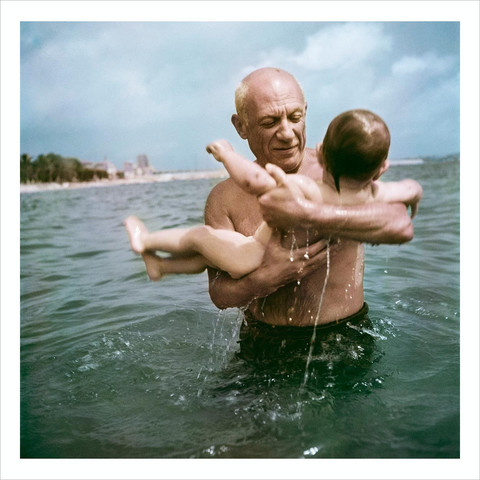 Pablo Picasso playing in the water with his son Claude. Vallauris, France. 1948.