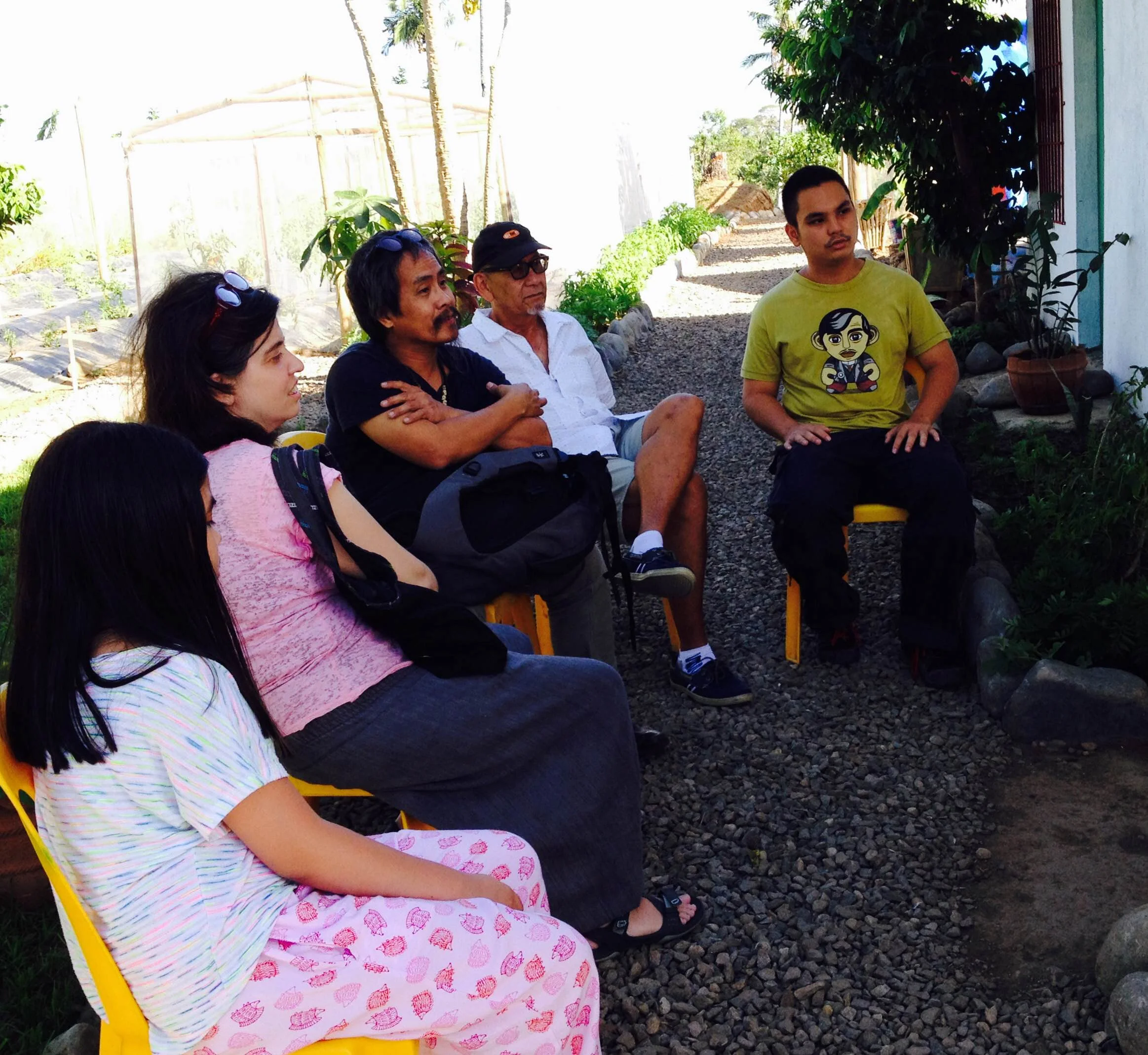 Listening to a talk on organic farming are Katya Guerrero, At Maculangan and their daughter Anika, Dado Jose and Enzo Tesoro. 