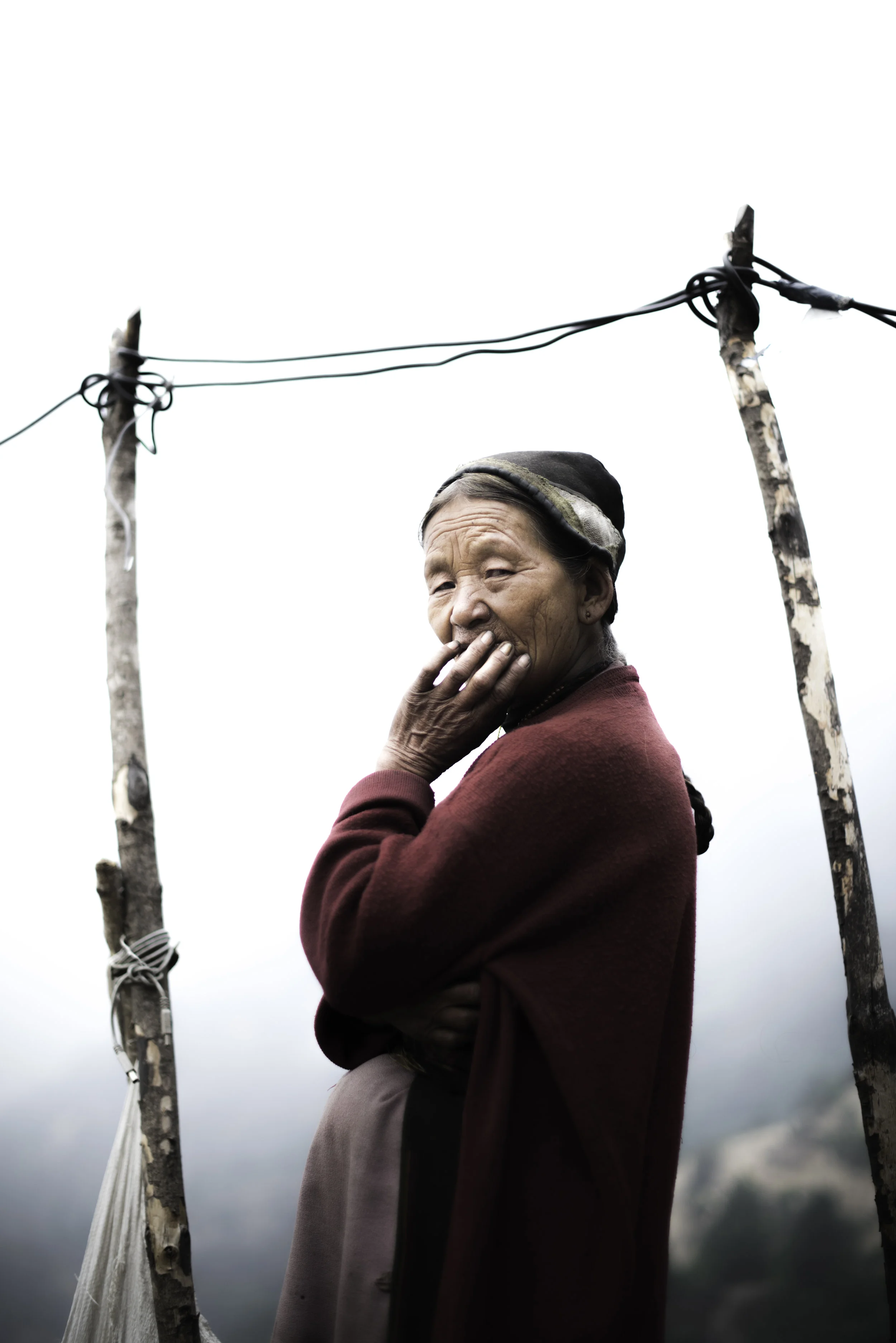   Nyima Gyalmu Tamang in Bhanjyangaon. Since 25 April 2015 she has been living in temporary structures, like many others. They are flimsy tarpaulin,&nbsp;corrugated iron and plastic sheets. She has no income and because as a widow she owns no land an