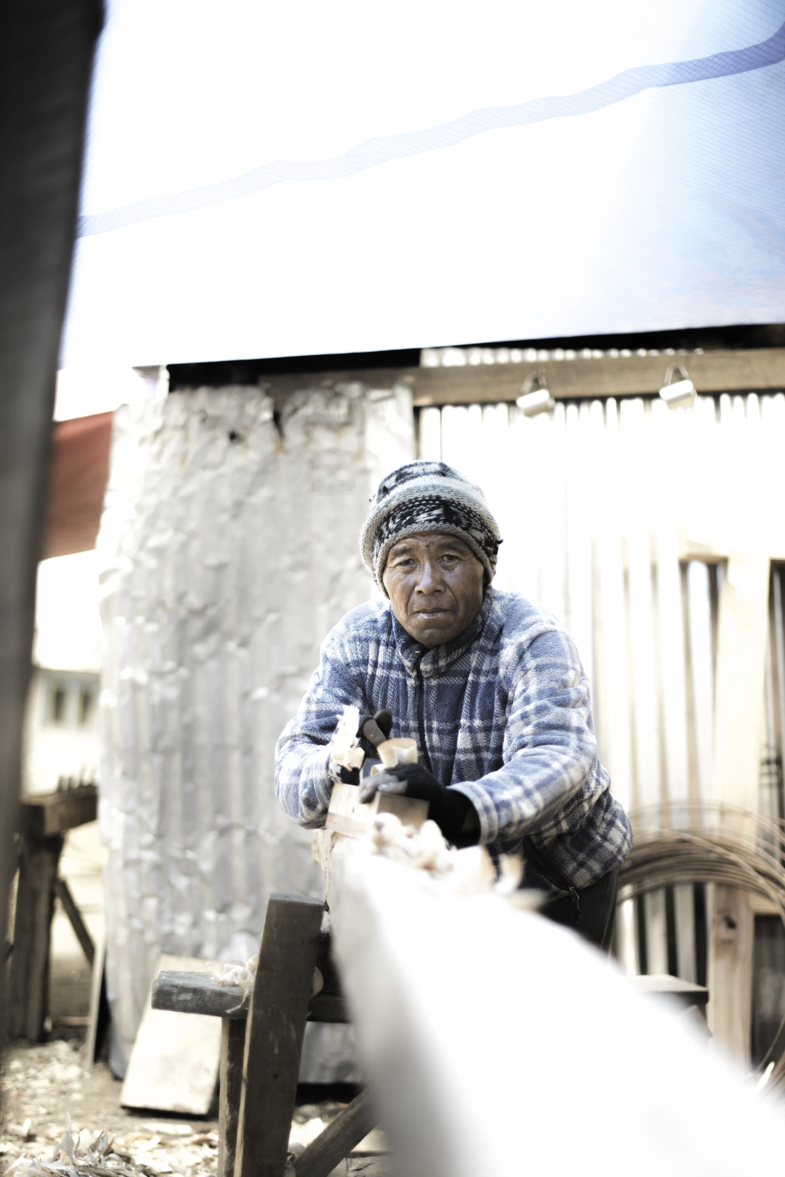   The pace of rebuilding is picking up, with hammers knocking throughout the valley and the paths full of workers carrying cement, wooden beams and rocks.&nbsp;    Lobsang is a carpenter who has travelled from Okuldhunga to volunteer in the project.&