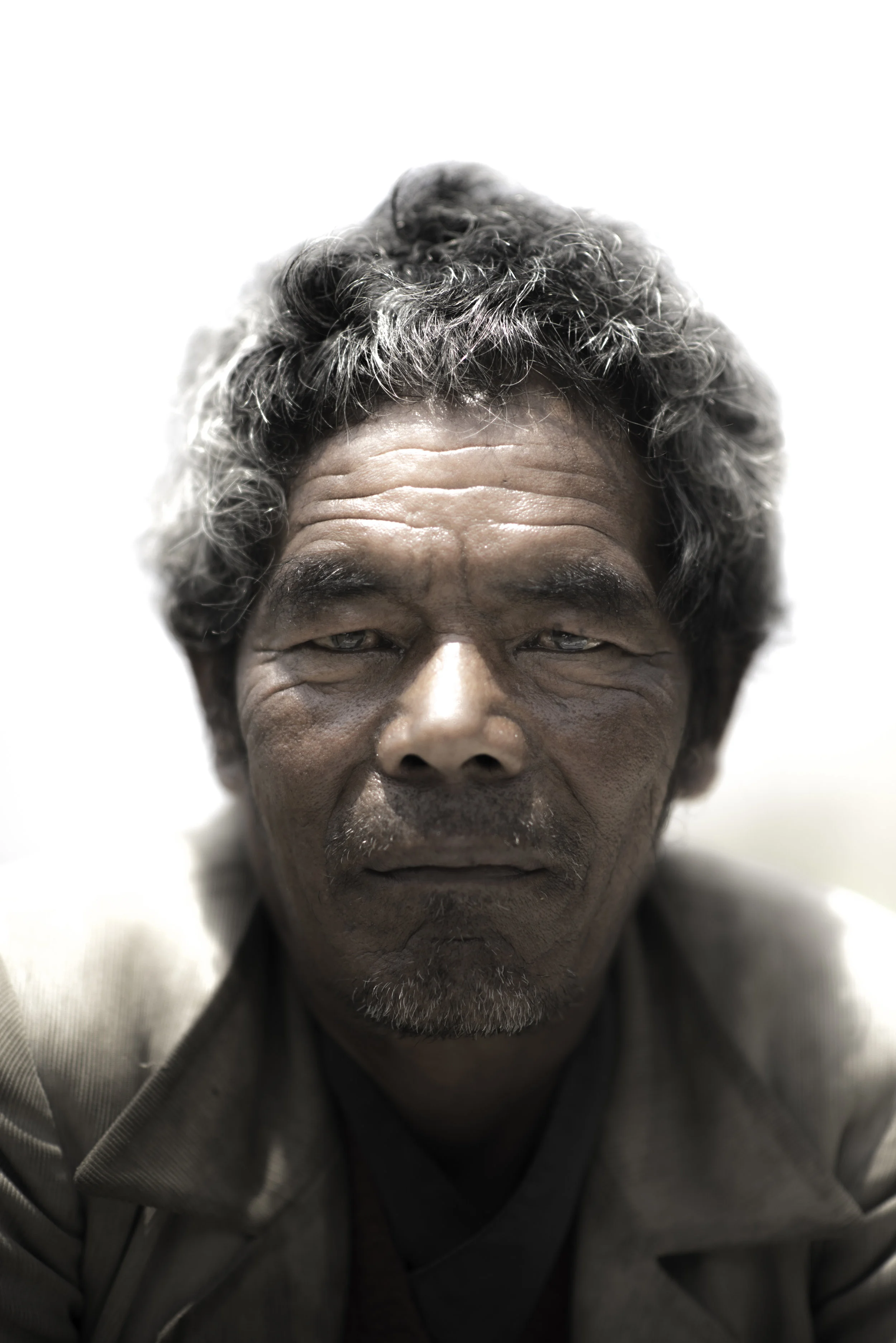   Khasi is a porter from a small hamlet below Khangjim.&nbsp;Work has been hard for him to find in the last year.&nbsp;Drinking the local rice beer otherwise known as Chhaang is how passes the time.&nbsp;  